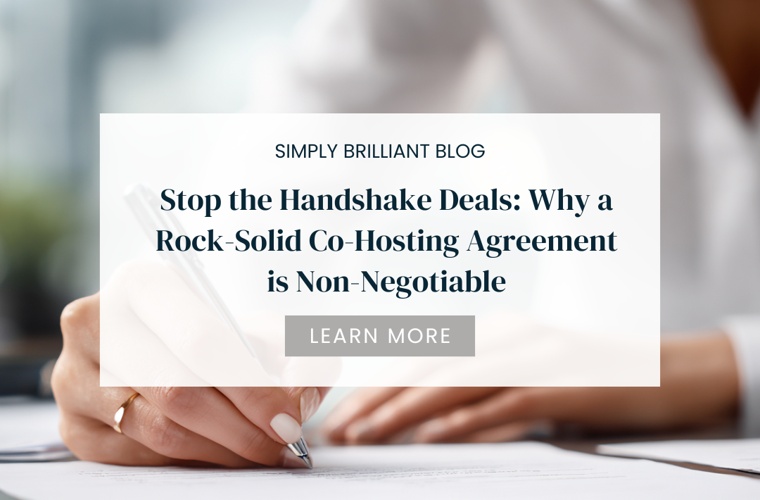 Woman’s hand signing paperwork on a desk, representing contracts or agreements.